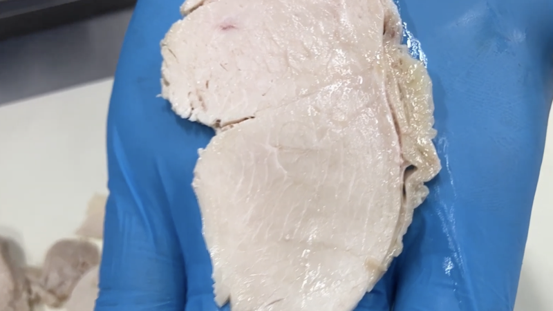 Close-up of evenly sliced cooked chicken breast