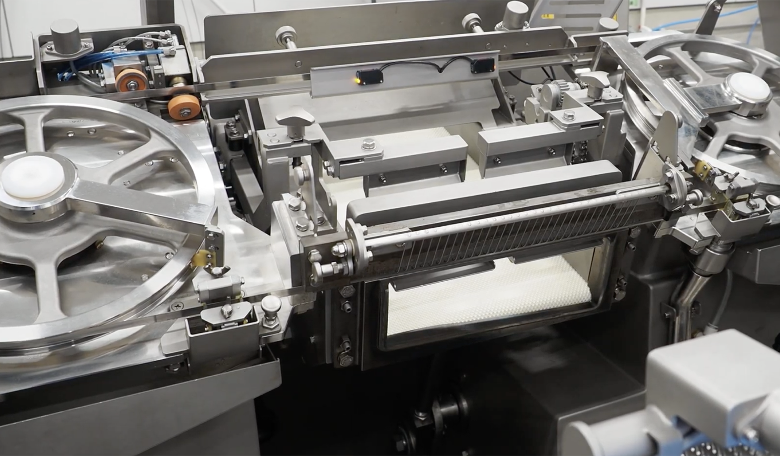 Protective cover shielding the sensitive sensors on an NCI slicer during washdown